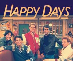 a group of people sitting around a table with the words happy days on it