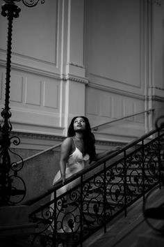 A woman standing on a beautiful staircase. Vintage Location Photoshoot, Vintage Prom Photoshoot, Vintage Birthday Pictures, Mysterious Photoshoot Ideas, Aesthetic Prom Pictures Vintage, Sophisticated Senior Pictures, Fancy Photoshoot Ideas, Museum Prom Pictures