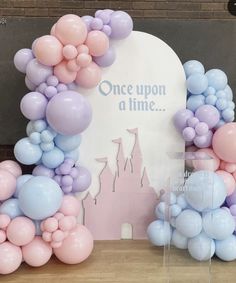 balloons are arranged in the shape of castle and castle with once upon a time sign