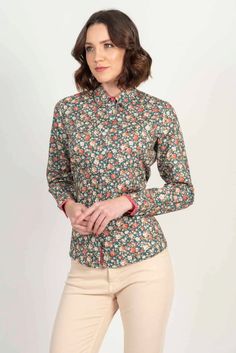 Pink Roses The new floral printed shirt features small pink roses on a crisp teal cotton satin lycra fabric. A beautiful design for Spring/Summer, with beige piping and cover button. 100% cotton satin lycraSlim fittingSmall collarContrast color inside collarContrast cover button on collarContrast color inside cuffContrast piping inside placket and cuffDouble buttons on cuffHidden modesty buttonMachine washable up to 30 degrees Celsius Roses Luxury, Hands Free Bag, Lycra Fabric, Elegant Bags, Floral Print Shirt, Covered Buttons, Floral Printed, Pink Roses, Piping