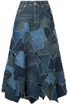 a skirt made out of blue jeans with patches on the bottom and side, as well as