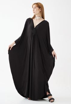 "🚚..ALL ORDERS ARE SHIPPED VIA DHL EXPRESS MAIL This soft black caftan dress is a great timeless wardrobe essential that you should not miss. Great for all shapes and sizes. * Pullover style * Deep v neck * Ruched detail at front with weaving rope strips * Batwing sleeves * Relaxed fit * For a slouchy silhouette * Unlined Measurements approximately: Sleeve Length (from side of neckline): 25\" (63.5 cm) Sleeve cuff: 18\" (46 cm)-round Bust: 66\" (168 cm)-all around. Hips: 60\" (152 cm)-all aroun Elegant Long Thobe For Vacation, Bohemian Style Long Evening Kaftan, Elegant Maxi Length Abaya For Vacation, Elegant Beach Thobe In Tunic Style, Elegant Long Abaya For Vacation, Elegant Long Thobe For Beach, Elegant Black Kaftan For Beach, Elegant Long Sleeve Thobe For Beach, Elegant V-neck Thobe For Vacation