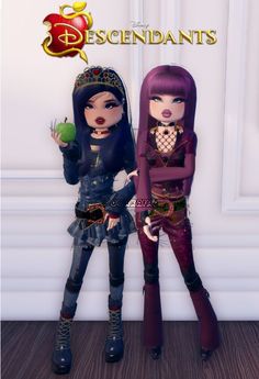 two dolls standing next to each other in front of a white wall with the words descendants on it