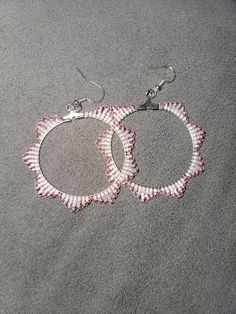 Pink and white hoop beaded earings diameter 2 in. Hypoallergenic stirling silver hooks Beaded Metal Hoop Earrings, Beaded Metal Small Hoop Earrings, Small Hoop Beaded Metal Earrings, Beaded Small Hoop Earrings In Metal, Small Beaded Metal Hoop Earrings, Small Beaded Hoop Earrings In Metal, Metal Hoop Beaded Jewelry, White Metal Hoop Earrings For Summer, Summer White Metal Hoop Earrings