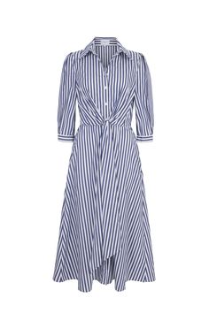 The best selling Priscilla has been re-introduced this season in a new navy and white colour way. An effortless, organic cotton striped summer shirt dress. The shirt dress has simple clean lines with a crisp beautiful collar and cuffed sleeves. The style is feminised with the tie waist detailing which draws in the elasticated waistline . The effortless day dress has a flattering line, whilst being comfortable and super easy to wear. The dress has side pockets and is a long midi length. Style with a stylish straw hat and tan flats or sneakers for casual style or elevate with a simple navy blazer for summer office wear. Styled with the Lawn Boater in collaboration with milliner Ruth Ravenscroft. Organic Cotton, Relaxed Fit. --- - Outer: 100% Organic Cotton from Spain - Dry Clean or Cool Mach Summer Shirt Dress, Summer Office Wear, Feminine Casual, Gamine Style, London Boutique, Shirt Dress Summer, Summer Office, Long Midi, White Colour