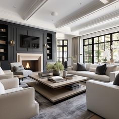 a living room filled with furniture and a fire place in the middle of a room