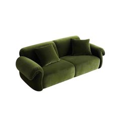 a green couch sitting on top of a white floor