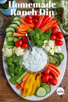 a white plate topped with veggies and dip