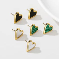 Embrace Timeless Cuteness: The Seoulful Heart Studs - A Touch of Korean Charm Add a touch of K-Pop charm to your everyday look with the Seoulful Heart Studs. Inspired by the romantic and trendy styles of Korea, these earrings feature delicate stainless steel hearts adorned with beautiful vintage green natural stones. A Modern Take on Vintage Charm: The Seoulful Heart Studs are the perfect blend of modern minimalism and vintage elegance. The small, polished stainless steel hearts offer a touch of Elegant Stainless Steel Heart Earrings, Valentine's Day Stainless Steel Heart Earrings, Festival Chic, Straw Bags, Heart Studs, Chic Accessories, Steel Jewelry, Stainless Steel Jewelry, Accessories Necklace