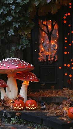 some pumpkins are sitting on the ground in front of a house with lights and decorations