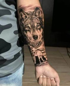 a man with a wolf tattoo on his arm