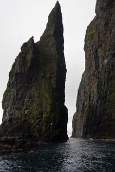 two large rocks sticking out of the water