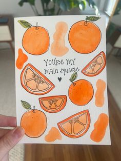 someone holding up a card with oranges on it that says, you're my main squeeze