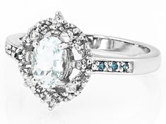 0.60ct Oval Aquamarine, 0.04ctw Round White Zircon With 0.05ctw Round Blue Diamond Accent Rhodium Over Sterling Silver Ring. Measures Approximately 0.52"L x 0.45"W. Not sizeable. Accent stones primarily zircon. White Diamond Cluster Ring With Accent Stones, White Topaz Ring With Diamond Accents, Fine Jewelry, White Oval Topaz Ring With Center Stone, Oval White Topaz Ring With Diamond, White Oval Topaz Ring With Prong Setting, White Oval Topaz Ring Fine Jewelry, White Oval Topaz Ring With Brilliant Cut, Aquamarine Blue, Blue Diamond