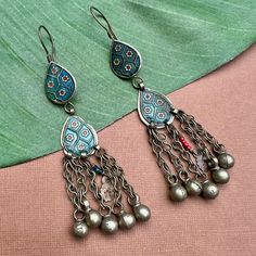 Turquoise blue with red flower inlay teardrops with dangles. White metal earrings from Afghanistan. May be used as components in jewelry or worn as earrings. 4.5" long from top of earwire. Top teardrop 18 x 22mm, bottom teardrop 20 x 24mm, dangles 1.75" 1 pair - $12.00 Red Flower, Metal Earrings, White Metal, Turquoise Blue, Red Flowers, Turquoise, Beads, Flowers, Red