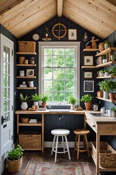 a kitchen with wooden shelves and plants on the windowsill, along with an area rug