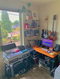 there is a desk with musical equipment in the room