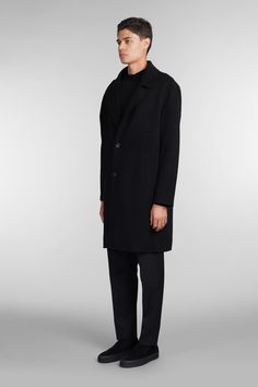 Coat double Coat in black wool, classic revers, long sleeves, frontal buttons closure, welt pockets, buttons on neck, back slip, 100% wool, Made in China, Model is 183 cm and wears size L Classic Outerwear With Concealed Placket And Straight Hem, Modern Tailored Black Wool Coat, Classic Outerwear With Straight Hem And Concealed Placket, Business Wool Coat With Long Sleeves, Modern Black Wool Coat For Work, Black Wool Long Coat With Concealed Front, Black Wool Coat For Workwear, Black Long Wool Coat With Concealed Fastening, Black Wool Coat For Work