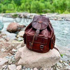 Moroccan Leather Backpack Vintage Leather Backpack Handmade Backpack Brown Backpack ## Product Characteristics ## -Dimension : (13.77H * 11.41W)inch  [35 cm H * 29 cm W ] -Color : Dark Brown -Material: 100 % Goat leather -100% Handmade - This backpack is handcrafted from high quality goat leather. The leather we use is treated with natural materials that make the leather has no unpleasant smell. This backpack is the best choice for your travels, because it is very durable and can withstand heavy weights. ##Note ## We still need your phone number for the shipping company can you please send it! Casual Leather Shoulder Backpack, Leather Backpack With Large Capacity, Leather Satchel Backpack For Outdoor, Large Capacity Leather Backpack Satchel, Leather Satchel Backpack With Large Capacity, Luxury Brown Shoulder Bag For School, Luxury Leather Shoulder Bag For School, Luxury Leather Shoulder Backpack For School, Daily Use Leather-backed Shoulder Backpack