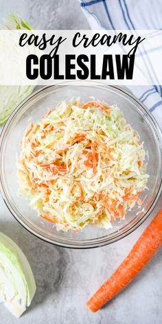 a bowl filled with coleslaw next to two carrots