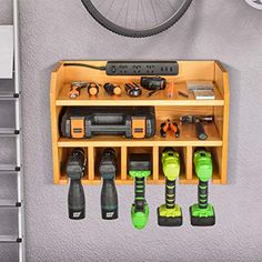 an overhead view of a garage with tools hanging on the wall next to a bicycle