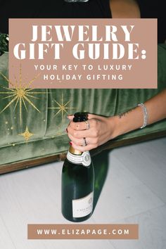 a woman holding a bottle of wine with the words jewelry gift guide on top of it