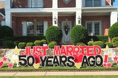 a sign that says just married 50 years ago in front of a house