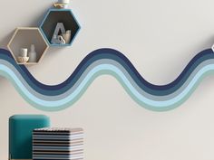 two shelves on the wall with different shapes and sizes, one is blue and white