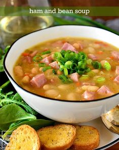 a white bowl filled with ham and bean soup