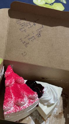 a piece of cake in a box with writing on it