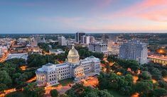 an aerial view of the capital building in washington, d c at sunset or dawn