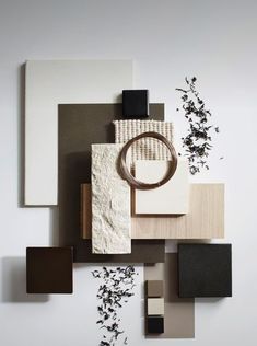 an assortment of different materials are arranged on a white surface with black and brown accents