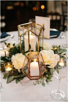 a table with candles and flowers on it