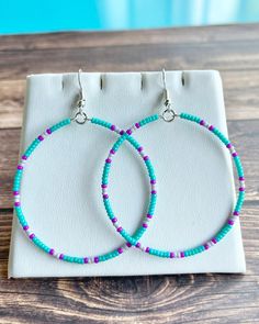 These hoop earrings are made with lightweight yet strong , Silver memory wire. They are made up of tiny, glass seed beads in beautiful Turquoise, Magenta, and Gray. They are finished off with Silver, Fish Hook style ear wires. Dangle Hoop Earrings With Tiny Beads For Beach, Bohemian Round Hypoallergenic Beaded Earrings, Bohemian Hypoallergenic Round Beaded Earrings, Turquoise Hoop Jewelry With Tiny Beads, Turquoise Hoop Earrings With Colorful Beads, Turquoise Hoop Earrings With Tiny Beads, Handmade Turquoise Hoop Earrings For Beach, Turquoise Hoop Earrings With Round Beads, Bohemian Hypoallergenic Small Hoop Beaded Earrings