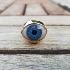 Evil Eye Medium Signet Ring. This beautiful ring is quite a statement. If you love different unique jewelry, then this ring is for you!. Chunky and heavy in both material versions. This eye ring is made to order in two different materials: .925 sterling silver Solid 18k gold (yellow or white). For a small additional fee, we also offer the option to engrave something in the inside of the band, like a name, a date, etc. Please allow up to 4 -6 weeks to work in your order. Some times it can take on Mystical Internally Threaded Jewelry As Gift, Mystical Internally Threaded Jewelry For Gift, Mystical Internally Threaded Jewelry For Gifts, Eye-catching Evil Eye Jewelry For Gift, Eye-catching Handmade Jewelry For Gifts, Unique Evil Eye Jewelry Gift, Unique Evil Eye Jewelry As A Gift, Unique Eye-shaped Jewelry For Gifts, Handmade Spiritual Eye-shaped Jewelry