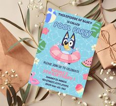 this is an image of a pool party birthday card with penguin on floater and flowers