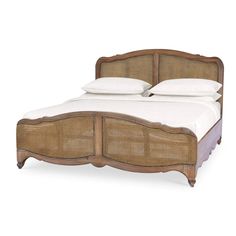 a bed with wicker headboard and foot board on it's sides, in front of a white background