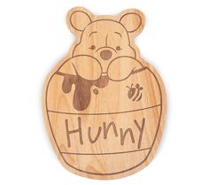 a wooden toy with the word humpy on it's face and an image of a bear in a honey jar