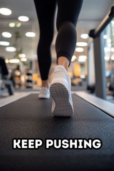 a woman is running on a treadmill with the words keep pushing above her feet