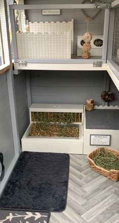 the inside of a small house with hay and other things in it's storage area