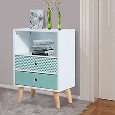 a white and blue cabinet with two drawers