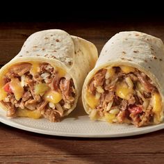 two burritos with meat and cheese on a plate