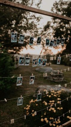 several photos hanging on a string with clothes pins and pictures pinned to the line in front of them