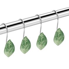 four green leaves hang from a metal bar on a white background with clippings