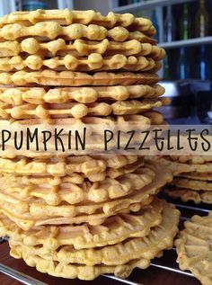 a stack of cookies sitting on top of a cooling rack