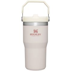 the stanley travel mug is white and has a handle on it