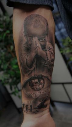 a man's leg with tattoos on it and an image of a person covering his eyes