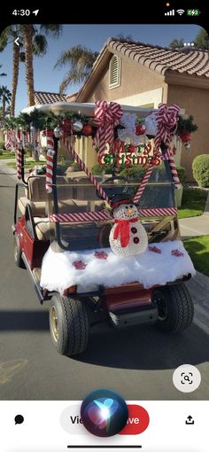 a golf cart decorated with candy canes and snowman on the roof for christmas