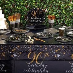 a table topped with lots of cakes and desserts