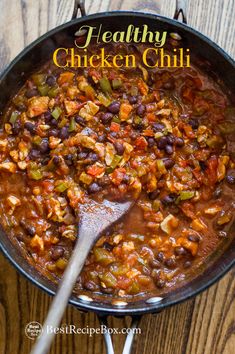 healthy chicken chili in a skillet with a spoon on the side and text overlay that reads, healthy chicken chili